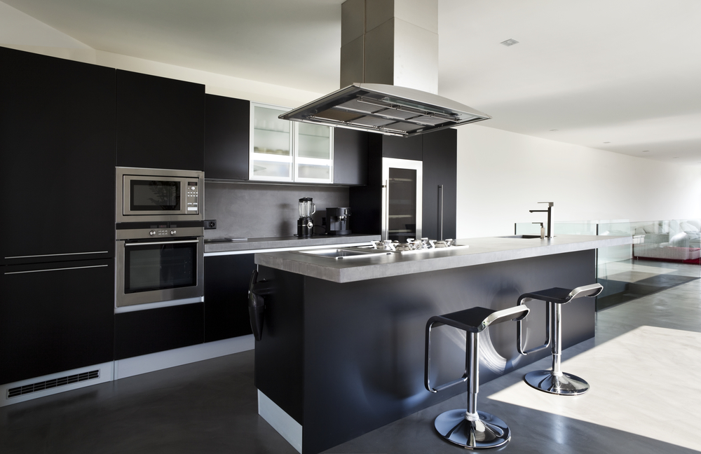 Modern kitchen in black tones with natural lighting