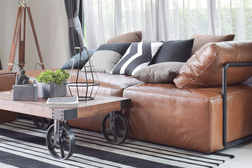 An industrial-style brown sofa.