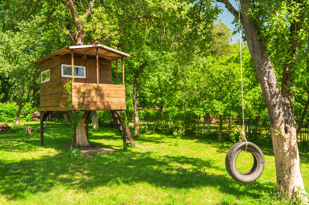 Any child would be thrilled to have a tree house in their own backyard playground.