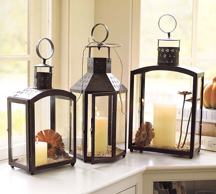 Use candles and pine cones to create the perfect fall decor for your candles.