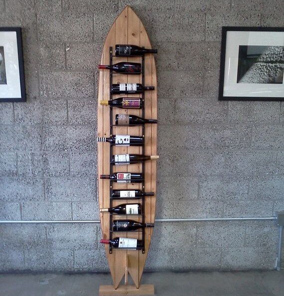 Surfboard as a bottle rack.