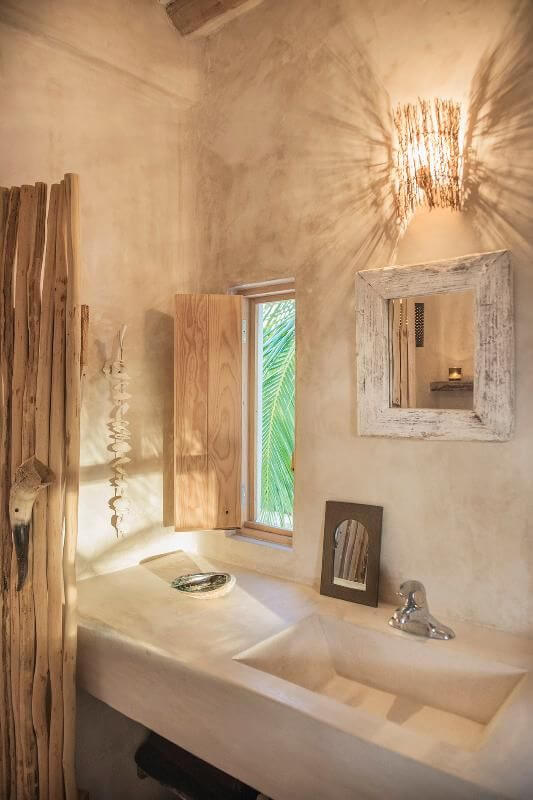 A bathroom in a rustic home with natural wood details.
