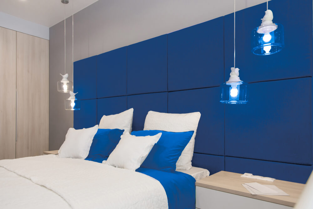 A bedroom decorated in blue.