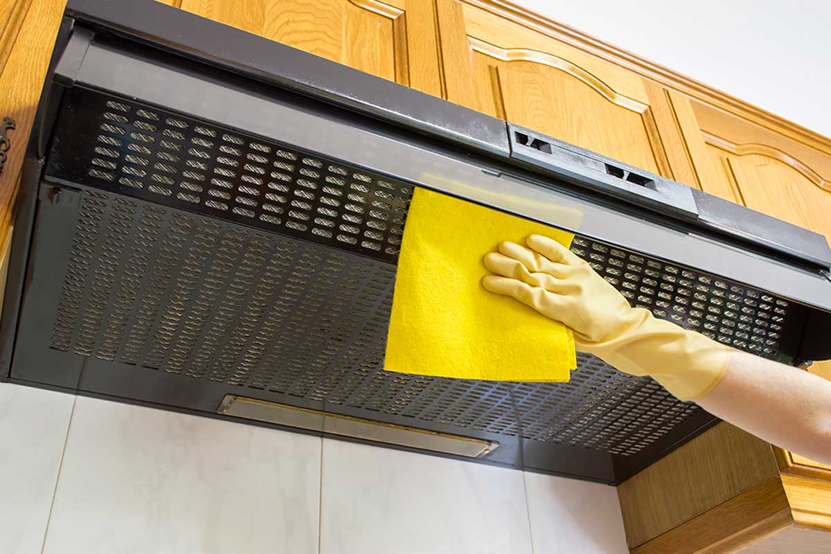 Clean the outside of the kitchen extractor hood.