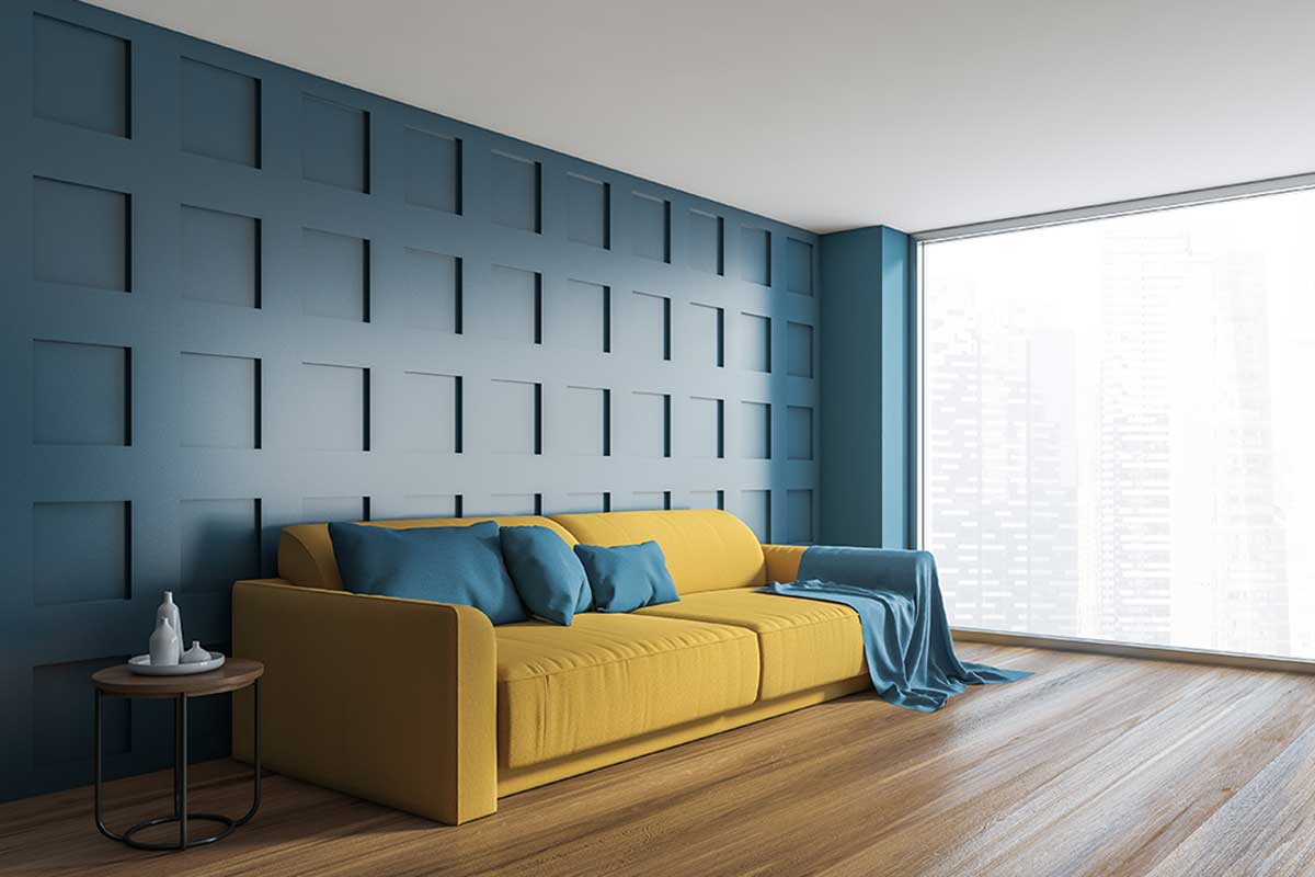 Blue wall and yellow sofa.