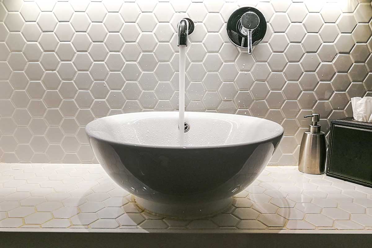The wall-mounted faucet is in trend in autumn bathrooms in 2021.