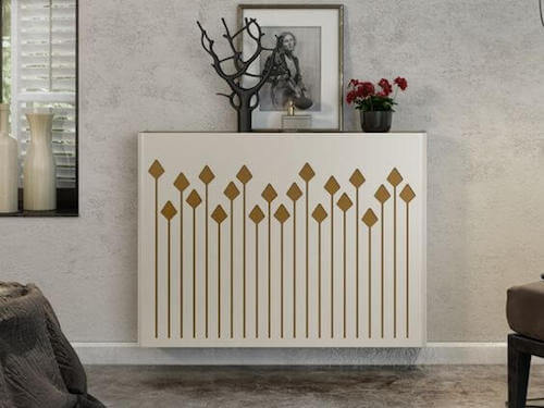 termosifone bianco con motivi decorativi geometrici color oro