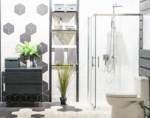 Geometrische badkamer met een plant en donkere kleuren