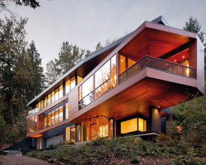 With its huge windows and chic design, this is a great example of how modern country houses look.