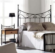 A wrought iron headboard will add a touch of elegance to your room.