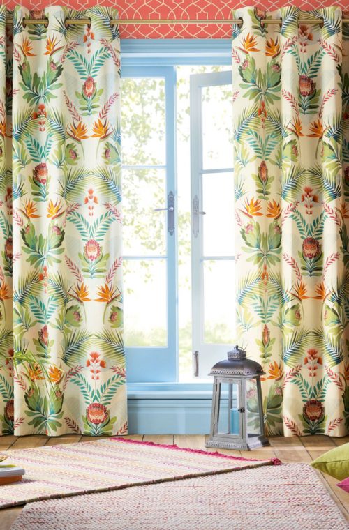 Stamped floral curtains provide a traditional feel
