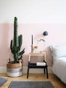 Adding a houseplant to your bedroom is a great finishing touch to the decor.