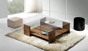 Glass-top coffee tables are more subtle, and won't attract attention away from the rest of your living room.