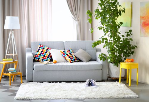Grey couch and yellow table.