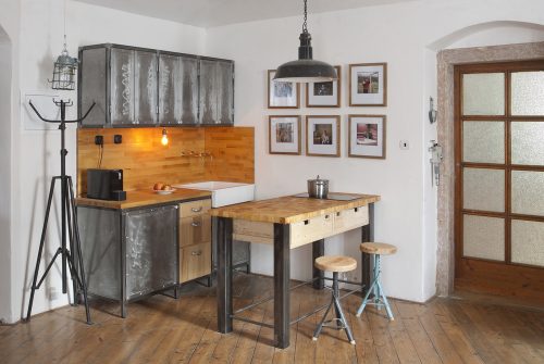 A rustic and industrial style kitchen should include timber and metal
