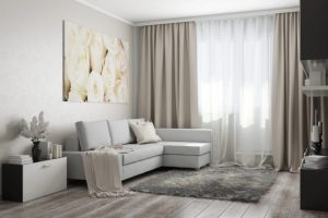 If your living room curtains are comprised of two layers of fabric, you can cross them for a romantic look.