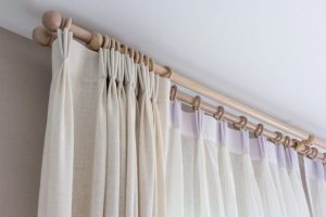 You can attach your living room curtains to a bar, rail or clips.