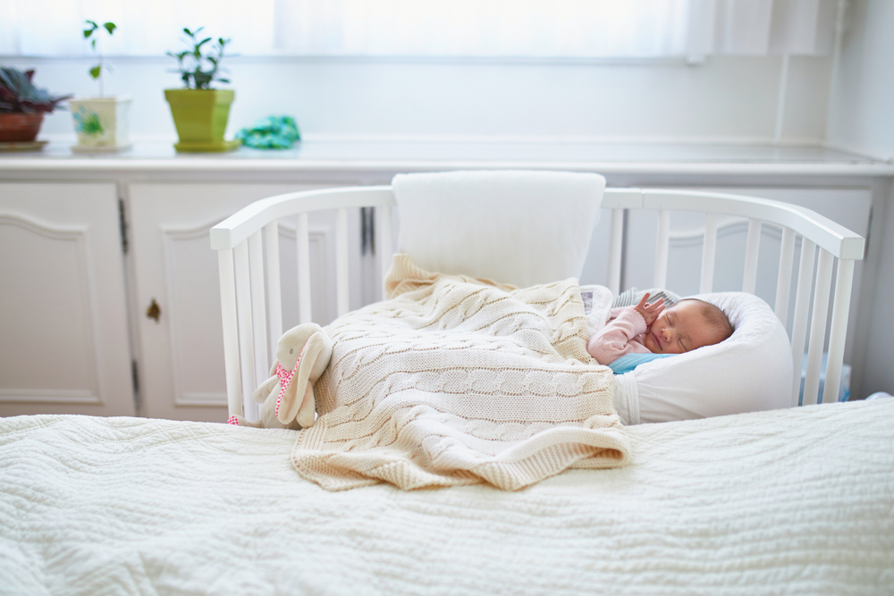 You'll need to be practical when creating room for the baby in your bedroom.