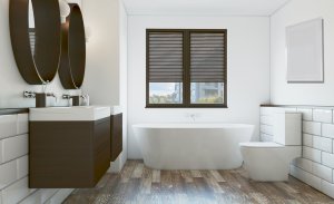 A bathroom with a combination of wood and the color white.