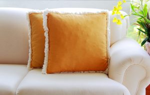 Use appliqué decorations such as tassels or pompoms to restore your cushions.