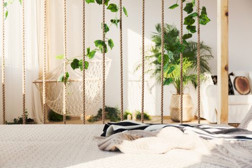 You could make a partition to divide the zones of your L shaped living room