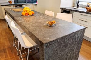 Duetto granite countertops are rust-colored and great for industrial style kitchens.