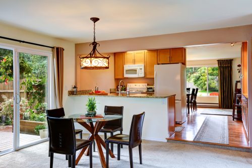 Use a half wall to divide areas of the home such as the kitchen and dining room