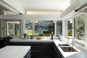 Add large windows and sliding doors to create an open air kitchen.