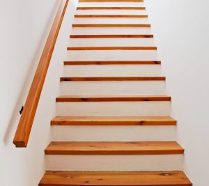 All you need for a minimalist banister is a simple wooden rail.