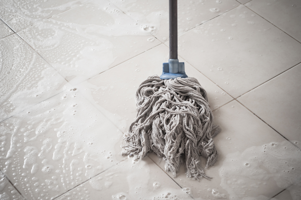 Cleaning kitchen stains can be tackled with a mop and bleach.