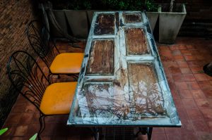 Recycle objects such as doors to make larger pieces of furniture.