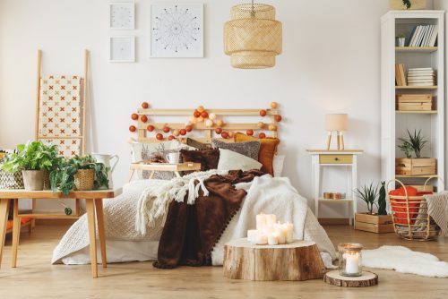 A rustic style bedroom can be bettered by including tables made using tree trunks to add a nice original touch