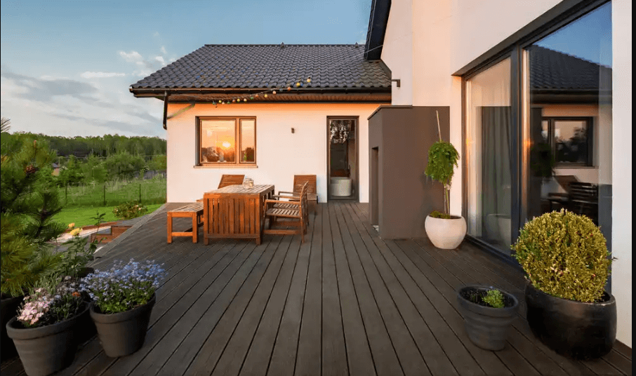 A country home with a beautiful deck.