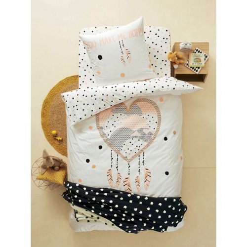 White comforter with a pink printed heart