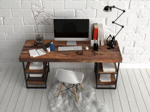 The New Yorker style work space with wood and brick wall.
