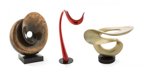 Three swirly sculptures made of marble
