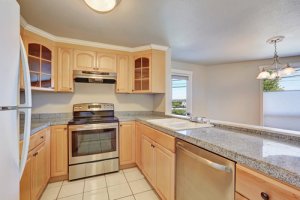 Light colors will help make your U-shaped kitchen seem more spacious.