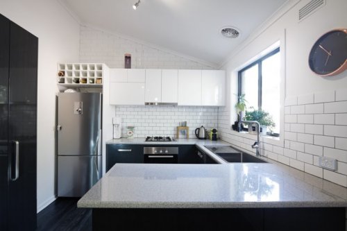 You could use a combination of half painted walls with tiles for decorating your kitchen