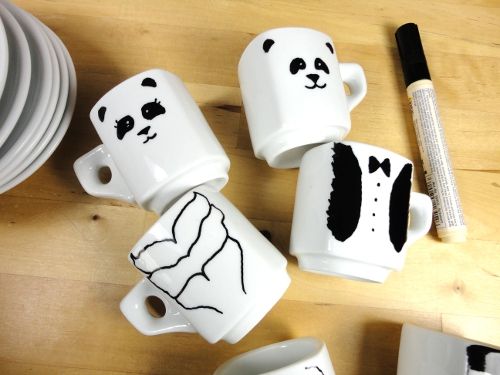mugs with a panda drawn on by marker