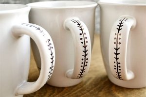 mugs with a black marker design on the handle