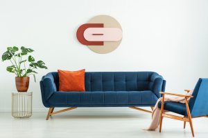 blue couch with copper-colored cushion
