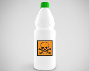A picture showing a bottle of ammonia with a skull and crossbones label on the front.