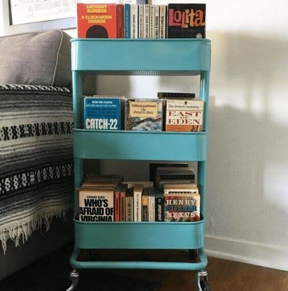 IKEA blue metal cart with stacked books