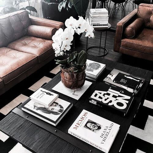 Pile a few stylish books with the same color scheme on the coffee table