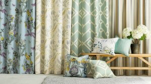 A series of elegant curtains in different styles and patterns on display.