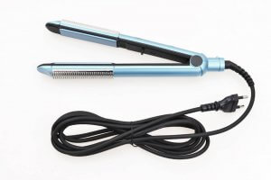 A picture showing a hair straightening iron with its cord bundled neatly.