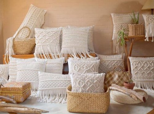 Macrame cushions are featured with different designs to create a theme