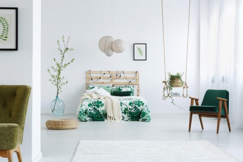 A nature themed bedroom with a practical swing shelf