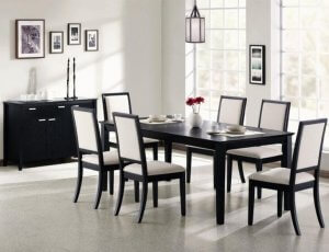 Dark chairs in a grayscale dining room.