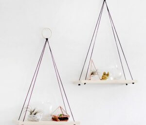 Two hanging shelves with accessories on them for diy decoration